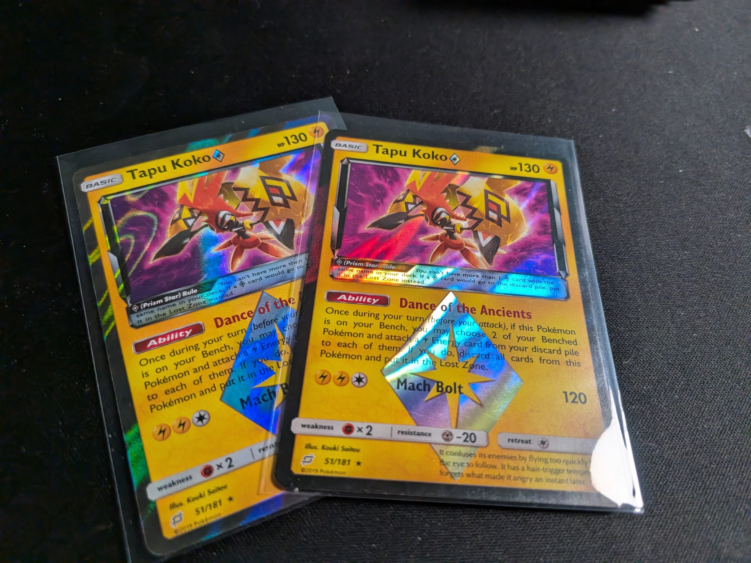 Two copies of the Tapu Koko Prism Star card from the Sun and Moon Team Up set.